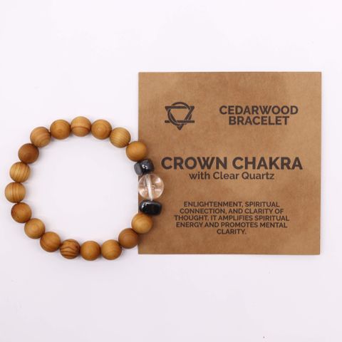 Discover the Cedarwood Crown Chakra Bangle with Clear Quartz, designed to enhance spiritual energy and mental clarity. The Clear Quartz stone amplifies your connection to higher realms, while the soothing cedarwood scent brings calm and insight. Perfect for meditation and spiritual growth, this bangle invites tranquility and enlightenment into your daily ritual. With a 7cm diameter and 1cm beads, it’s a meaningful gift for those seeking deeper self-awareness and mystical balance.