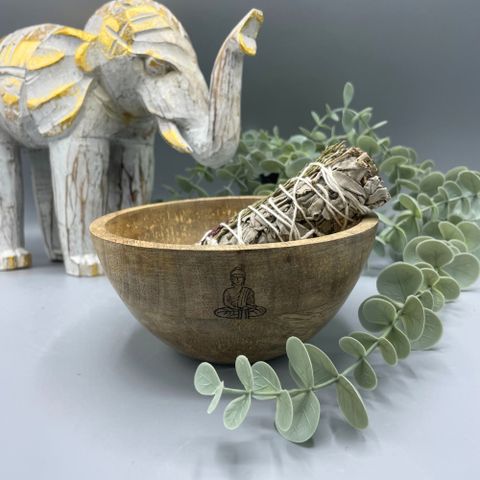 Invite serenity and mindfulness into your sacred space with this Wooden Smudge and Ritual Offerings Bowl – Buddha Design, a handcrafted vessel that embodies peace, balance, and enlightenment. Measuring 13 x 7cm, this natural wooden bowl is engraved with a Buddha motif, symbolising wisdom, compassion, and inner stillness.
Perfect for holding smudging herbs, resins, crystals, or sacred offerings, its smooth surface and organic texture create a grounding energy ideal for meditation and spiritual rituals. Whet