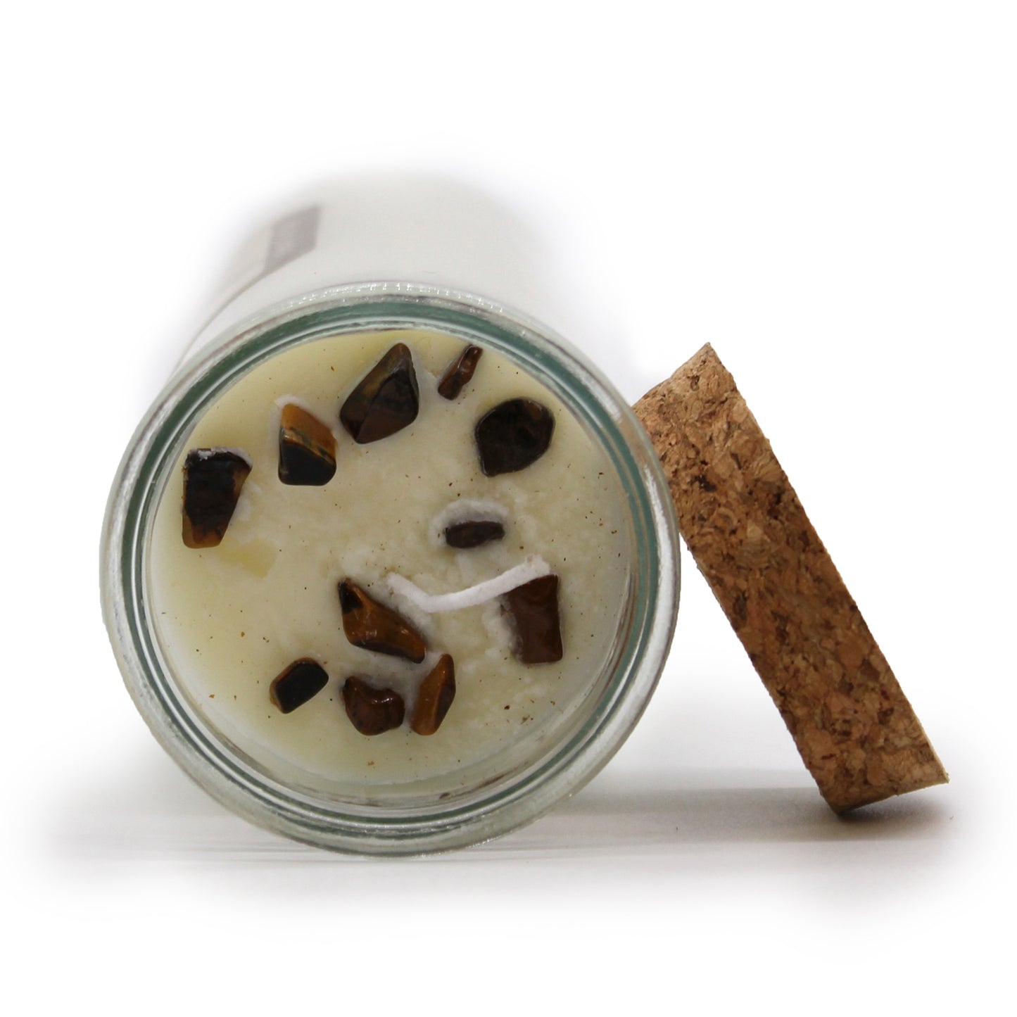Awaken your inner power with the Magic Spell Candle - Confidence. This enchanting candle fuels self-belief and courage, helping you stand tall with fearless determination. Nestled inside is a genuine Tiger Eye stone, a talisman of bravery and protection that strengthens your spirit. The rich, spicy aroma of cinnamon fills your space, sparking boldness and resilience. Crafted from clean-burning soy wax, it offers a steady, lasting fragrance while being kind to the earth. Once the magic fades, repurpose the g