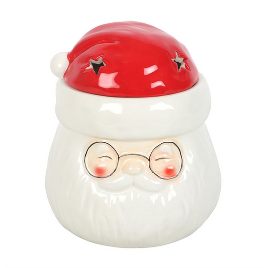 From The Witches’ Garden comes a merry enchantment to warm your hearth and home — the Santa Claus Shaped Oil Burner and Wax Warmer. Crafted from ceramic and brimming with Christmas cheer, this jolly Santa invites the spirit of Yule into every corner of your dwelling.
Simply lift Santa’s hat to reveal the dish above and fill it with your favourite festive essential oils or wax melts. A single tealight placed beneath releases a cosy, aromatic glow, infusing your space with comfort, joy, and the gentle hum of