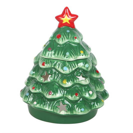 From The Witches’ Garden comes a timeless piece of festive enchantment — the Nostalgic Christmas Tree Oil Burner and Wax Warmer. Shaped like a traditional evergreen tree and crafted from ceramic, this charming burner brings the warmth and wonder of Christmas into your home with every flicker of candlelight.
Simply add a few drops of your favourite festive fragrance oil (diluted with water) or a wax melt to the dish above, place a single tealight below, and let the comforting aroma fill your space with the