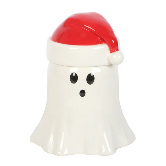 From the shadowed corners of The Witches’ Garden comes a delightfully eerie twist on festive fragrance — the Ghost with Santa Hat Oil Burner and Wax Warmer. Perfect for those who prefer their Christmas with a touch of spooky cheer, this spectral ceramic spirit dons a jolly red hat while haunting your home with warm, aromatic magic.
Lift the Santa hat lid to reveal the dish above, where you can add your favourite festive essential oils or wax melts. Place a tealight below and let the ghostly glow fill your