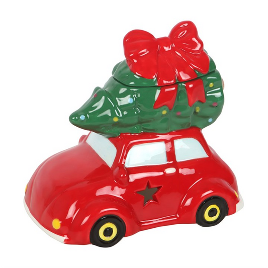 From The Witches’ Garden comes a heart-warming creation to fill your home with Yuletide magic — the Car with Christmas Tree Oil Burner and Wax Warmer. This nostalgic ceramic piece captures the spirit of a vintage red car carrying its Christmas tree home, ready to deck the halls and stir memories of simpler, joy-filled winters.
Add a few drops of your favourite festive fragrance oil (diluted with water) or a wax melt to the dish above, place a single tealight below, and let the comforting aroma drift throug