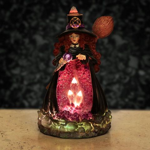 Measuring 18cm tall, 11cm wide, and 9cm deep, this enchanting Backflow Incense Burner requires 2 AA batteries (not included). Designed to channel smoke that flows downward, it creates a mesmerizing cascade of swirling mist that drifts gracefully over the tower, captivating all who behold it. Light your incense cone and watch as the heavier-than-air smoke spirals through the opening, pooling mysteriously at the base. Perfect for weaving magic in your home, office, teahouse, meditation space, or yoga sanctuar