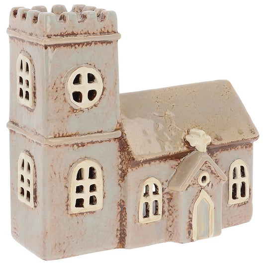 Bring sacred stillness and story-rich charm into your space with the Village Pottery Norman Church Tealight. 
Handcrafted with care and inspired by ancient Norman architecture, this ceramic tealight holder features arched windows, a stately bell tower, and rustic detailing that echoes the quiet strength of countryside chapels.
Place a tealight inside and watch the warm flicker of candlelight dance through the windows—casting peaceful shadows and filling your home with a soft, reverent glow. Whether d