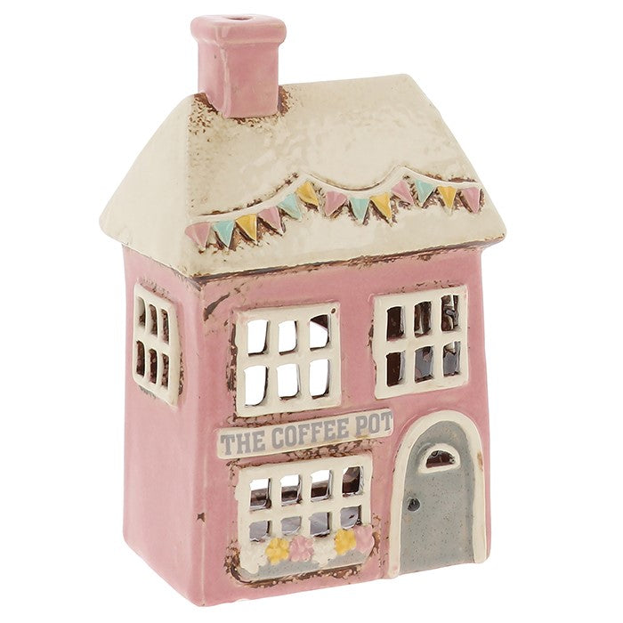 A place of quiet brewing and intention, where flame and warmth blend into ritual. This Shudehill Village Pottery ceramic tealight house glows like a potion in progress, perfect for morning spells, tea rituals, or sacred stillness. Let its light fill your space with calm focus, gentle energy, and everyday magic.