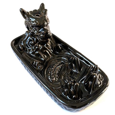 
Summon mystical energy into your sacred space with this striking Dragon in Mountain Backflow Incense Burner. Handcrafted with intricate detail, the fierce dragon coils around a craggy mountain peak, guarding the cascading waterfall of aromatic smoke. When paired with backflow incense cones, the smoke flows downward like enchanted mist, pooling at the base in a magical display.
Ideal for meditation, spellwork, or simply creating a calming atmosphere, this incense burner is both a functional tool and