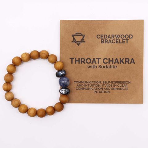 Embrace clear communication and intuition with the Cedarwood Throat Chakra Bangle featuring Sodalite. This enchanting bracelet combines soothing cedarwood aroma and the calming energy of sodalite to support self-expression and spiritual clarity. Perfect for those seeking to speak their truth and deepen their intuitive gifts, it’s a mystical treasure for your holistic collection. Bracelet diameter: 7cm; bead diameter: 1cm.