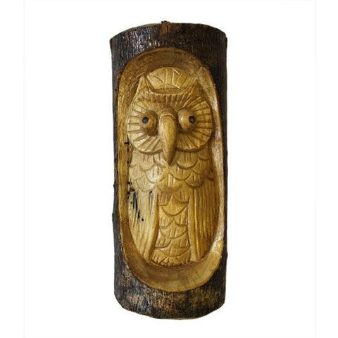 Discover the enchanting Owl in Trunk carving, measuring 24x11x5cm, a mystical piece crafted from the trunks of Chinaberry (Jempinis) and Hibiscus trees. This unique tree stump sculpture features the wise 'Man of the Wood' face intertwined with the owl, symbolizing ancient woodland spirits. Perfect for adding a touch of magic to your garden, conservatory, or patio, it serves as a guardian of nature’s secrets and a captivating focal point. Whether placed indoors or outdoors, this carved treasure invites the w