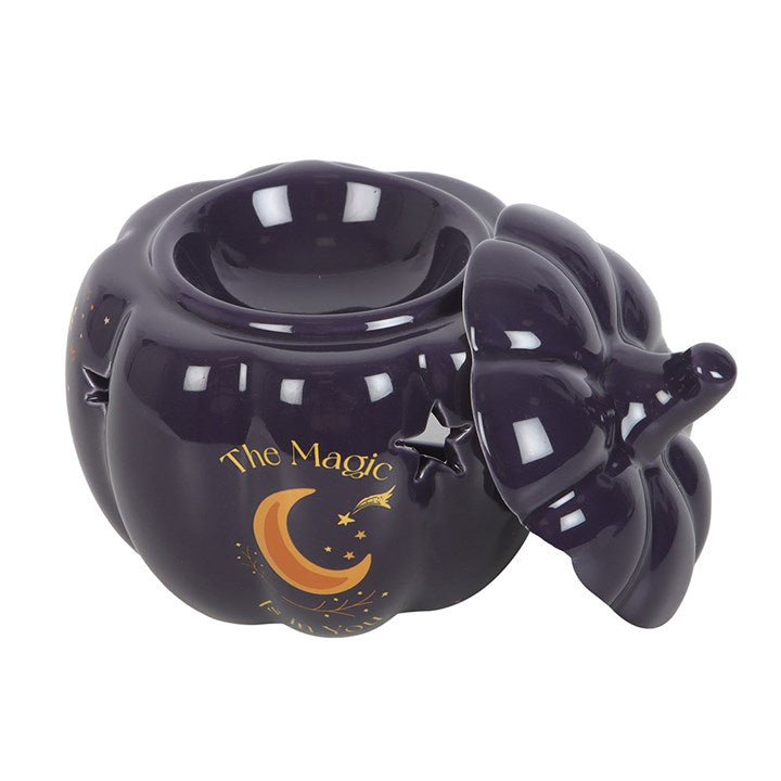 Embrace the enchanting glow of autumn with The Magic Is in You Pumpkin Oil Burner. Crafted from midnight-blue ceramic, this mystical pumpkin-shaped burner is adorned with shimmering golden stars and a crescent moon, inviting a touch of celestial magic into your space. Perfect for those who cherish the changing seasons and the warm, inviting scents that come with them, it transforms any room into a cozy sanctuary. Designed for use with fragrance oils diluted in water, it gently releases your chosen aromas, w