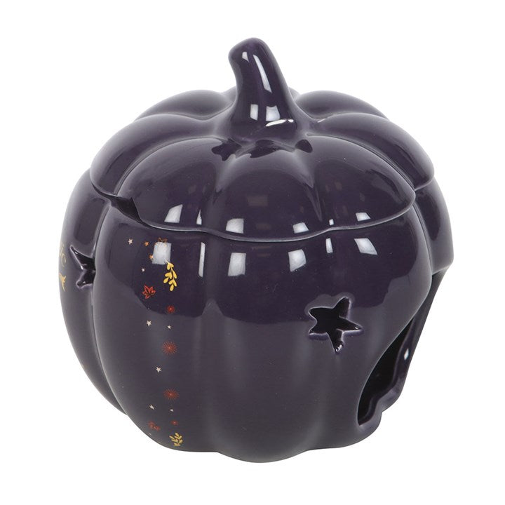 Embrace the enchanting glow of autumn with The Magic Is in You Pumpkin Oil Burner. Crafted from midnight-blue ceramic, this mystical pumpkin-shaped burner is adorned with shimmering golden stars and a crescent moon, inviting a touch of celestial magic into your space. Perfect for those who cherish the changing seasons and the warm, inviting scents that come with them, it transforms any room into a cozy sanctuary. Designed for use with fragrance oils diluted in water, it gently releases your chosen aromas, w