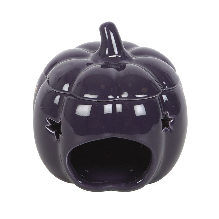 Embrace the enchanting glow of autumn with The Magic Is in You Pumpkin Oil Burner. Crafted from midnight-blue ceramic, this mystical pumpkin-shaped burner is adorned with shimmering golden stars and a crescent moon, inviting a touch of celestial magic into your space. Perfect for those who cherish the changing seasons and the warm, inviting scents that come with them, it transforms any room into a cozy sanctuary. Designed for use with fragrance oils diluted in water, it gently releases your chosen aromas, w