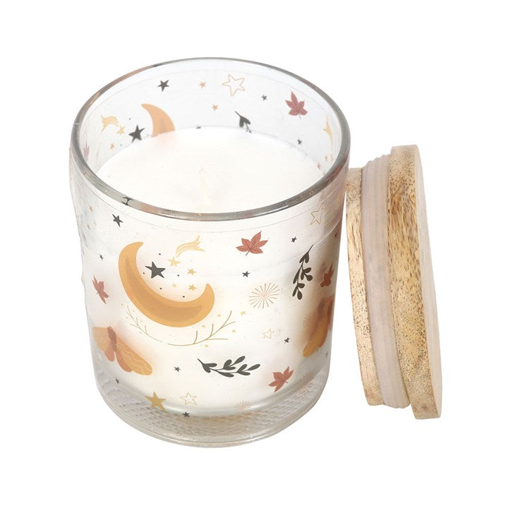 Embrace the enchanting spirit of the season with the Autumn Magic Spiced Vanilla Candle. Housed in a graceful glass jar adorned with an autumnal moon and delicate leaf motifs, this candle weaves a spell of warmth and comfort throughout your home. Its rich blend of spiced vanilla evokes cozy fireside moments and whispered secrets beneath harvest moons. With an approximate burn time of 28 hours, it invites you to create a sacred, inviting space where magic lingers in the air. Perfect as a thoughtful gift or a