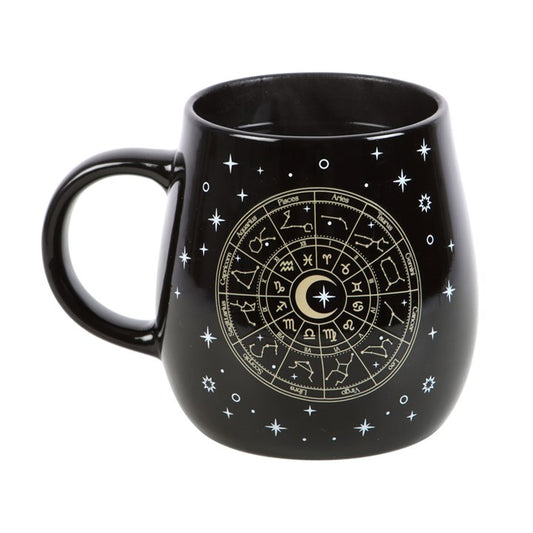 Infuse your morning ritual with cosmic enchantment using this mystical heat-sensitive mug. As warmth fills the 500ml black ceramic vessel, a radiant gold Astrology Wheel emerges, encircled by shimmering stars. Dishwasher safe for easy cleansing, but keep it away from the microwave to preserve its magic.