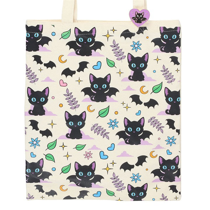 Tote bag with black cat and bat pattern on a light background