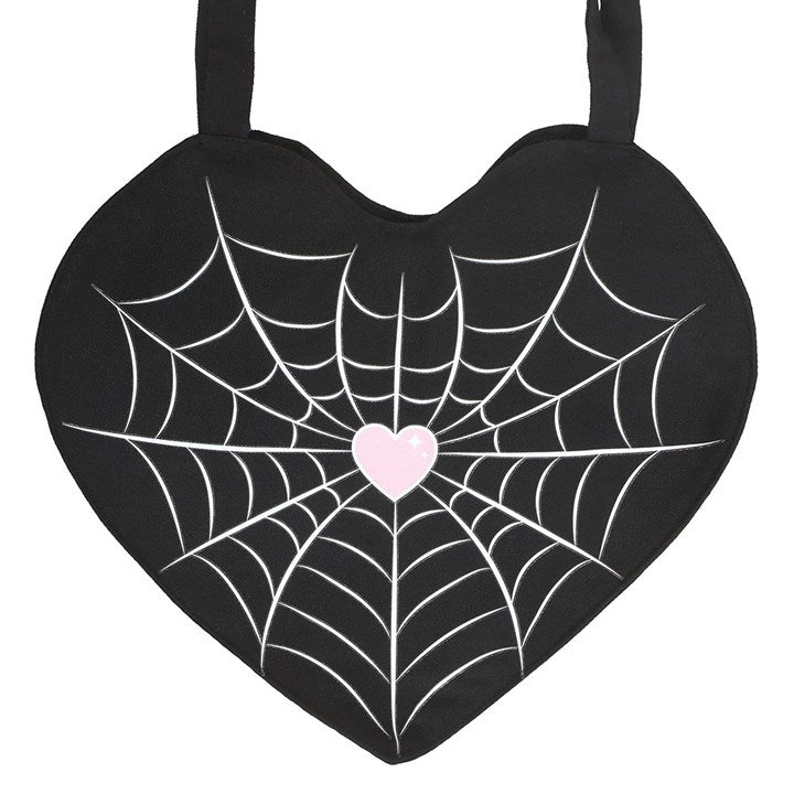 Heart-shaped bag with spider web design and pink heart center on a white background