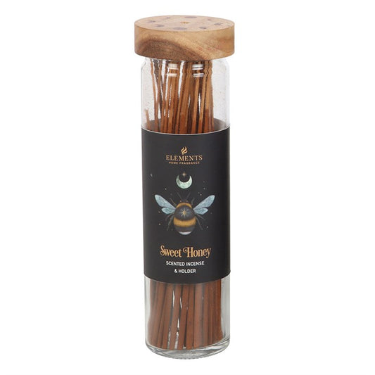 This collection offers 20 incense sticks adorned with an enchanting forest bee motif. Each container comes with a wooden lid that serves as a handy incense holder. The premium incense releases a sweet honey scent, cherished for its calming essence. Let this gentle fragrance weave a cozy, magical atmosphere in your sacred space.