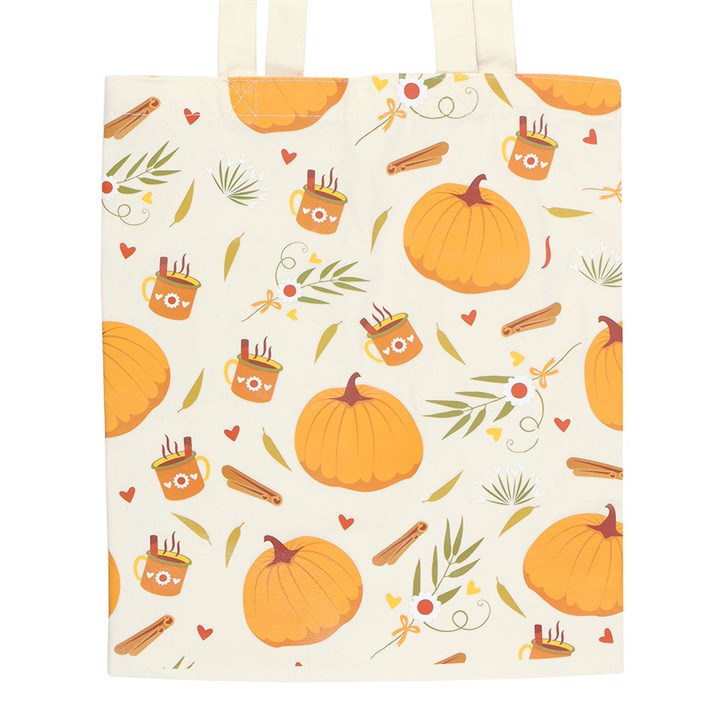 Tote bag with autumn-themed pattern featuring pumpkins, leaves, and mugs on a white background