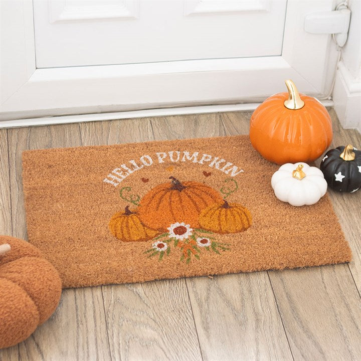 Embrace the enchanting spirit of autumn with this Natural Autumn Days Hello Pumpkin Doormat. Crafted from sturdy coir fibers, it welcomes guests with a warm "Hello Pumpkin" greeting framed by a mystical pumpkin design that captures the essence of the harvest season. Ideal for sheltered doorways or indoor use, this doormat invites cozy, magical vibes into your home while protecting your floors from the chill outside. Please note, the design may gently fade under extreme weather, preserving its charm for many