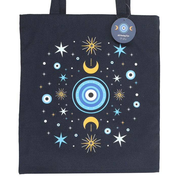 Black tote bag with celestial design featuring stars, moons, and planets on a white background.