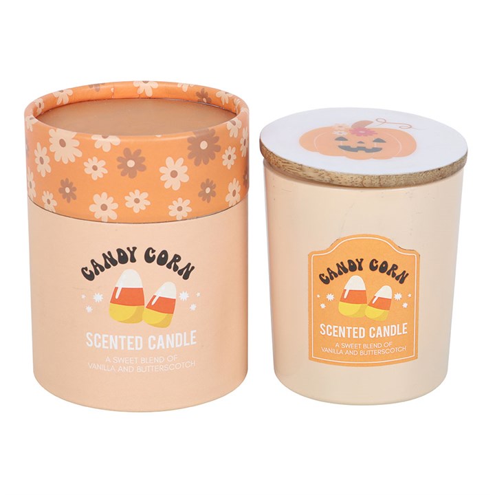 Embrace the enchanting spirit of autumn with this Candy Corn Vanilla and Butterscotch Candle. Infused with the sweet, nostalgic scents of candy corn, creamy vanilla, and rich butterscotch, it weaves a warm, magical aura perfect for spellbinding Halloween nights or quiet, cozy evenings. Housed in a glass holder adorned with pumpkin and candy corn motifs and sealed with a wooden lid, this candle invites a touch of mystical charm to your space. Presented in a matching cylinder box, it’s a bewitching gift for t