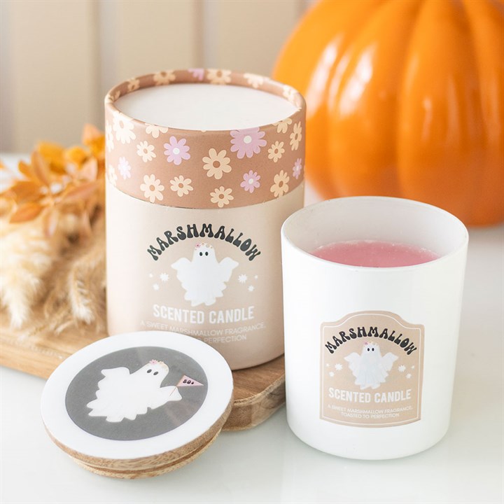 Illuminate your surroundings with the enchanting aroma of toasted marshmallow from this ghostly candle. Ideal for conjuring a bewitching ambiance at Halloween festivities, its warm and comforting fragrance weaves a spell of autumnal charm. Encased in a glass vessel topped with a wooden lid adorned with whimsical ghost and floral motifs, it arrives nestled in a matching cylinder box—an enchanting gift for any soul. Enjoy approximately 28 hours of mystical glow and scent.