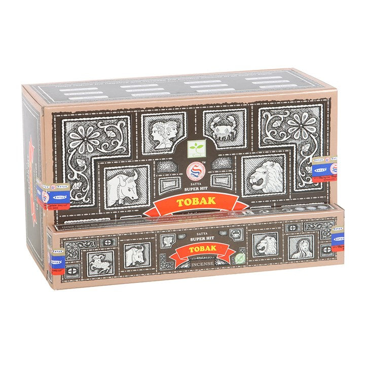 Embrace the enchanting aroma of Satya’s Superhit Tobak incense with this collection of 12 packs. Each stick weaves smoky, sweet whispers intertwined with deep spices, conjuring a warm and inviting sanctuary. Perfect for rituals or quiet moments, this vegan and cruelty-free treasure invites magic into your space. Sold as a set of 12 to keep your sacred fires burning.