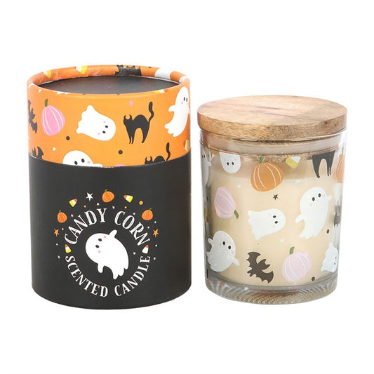 Indulge in the iconic scent of candy corn with this charming glass candle, perfect for adding a touch of sweetness to Halloween celebrations. Featuring a cute ghost design and a wooden lid, this candle is a must-have for seasonal décor or gifting. Approximately 28-hour burn time. Made from paraffin wax. Never leave a lit candle unattended.