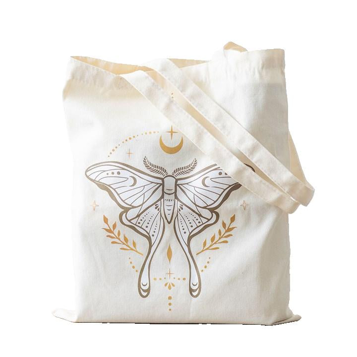 This durable polycotton canvas tote bag is ideal for carrying everything from groceries to daily essentials. Featuring an elegant luna moth design, it combines practicality with an ethereal sense of style.