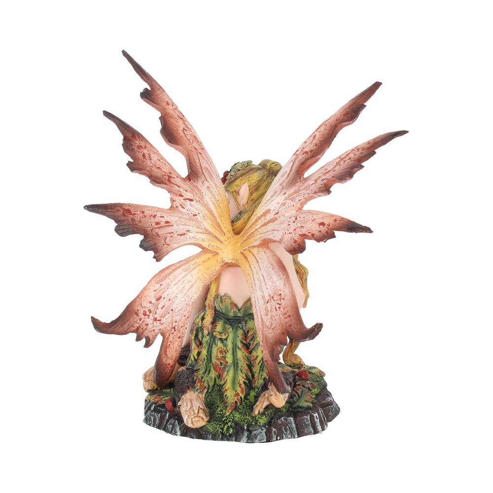 Statue of a fairy with large pink flower wings on a white background