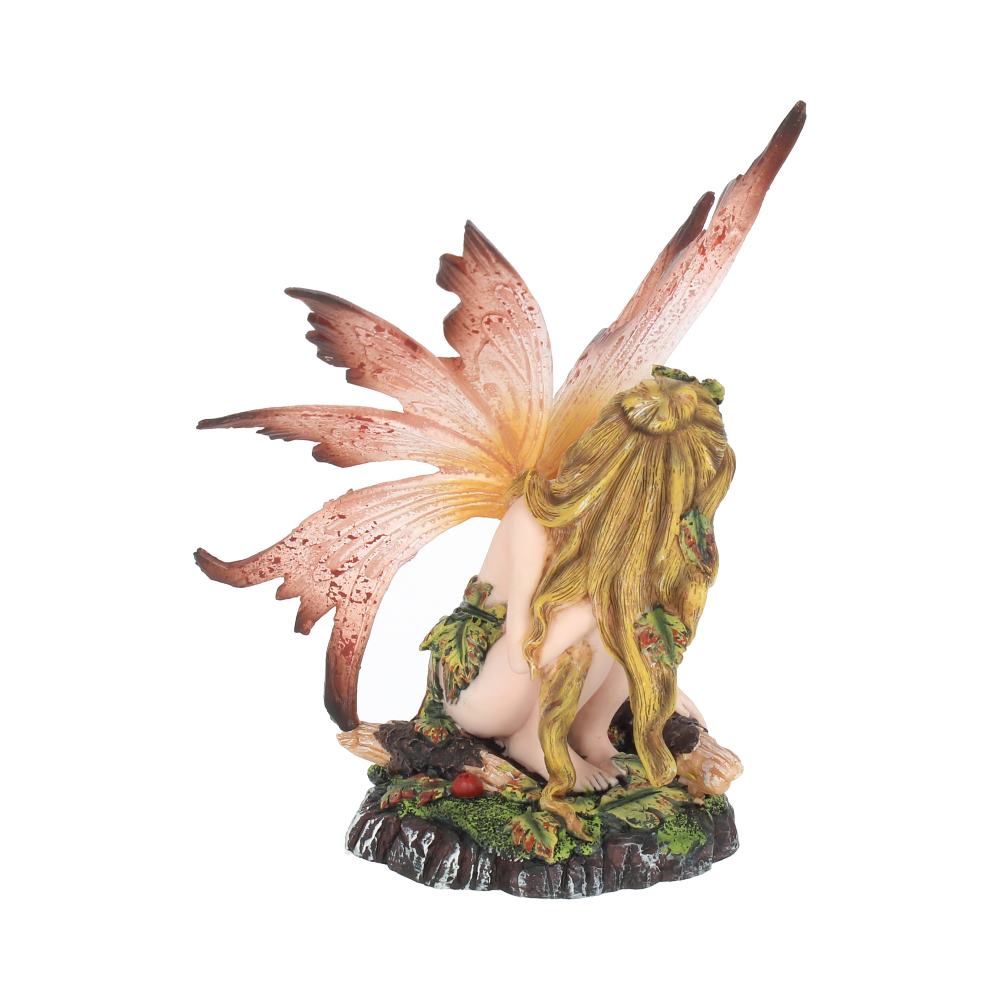 Fairy figurine with pink wings on a white background