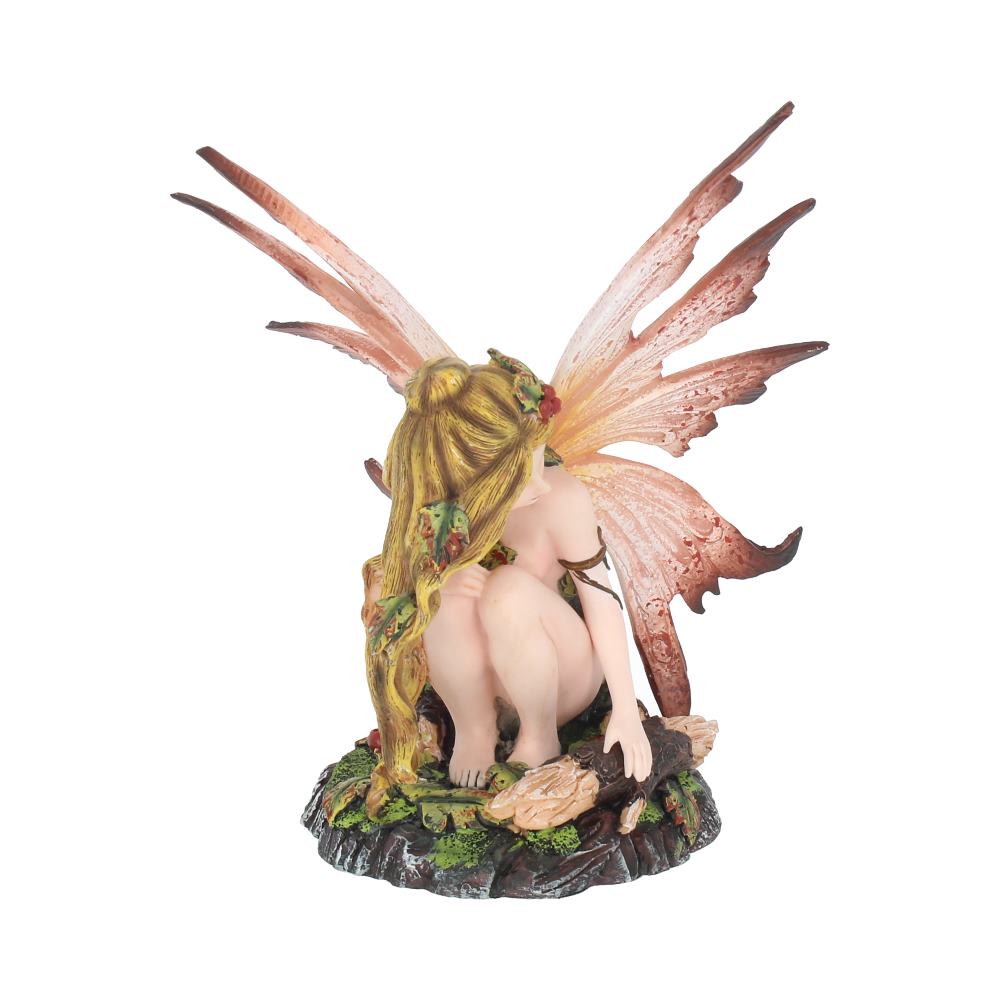 Fairy figurine with large wings on a white background