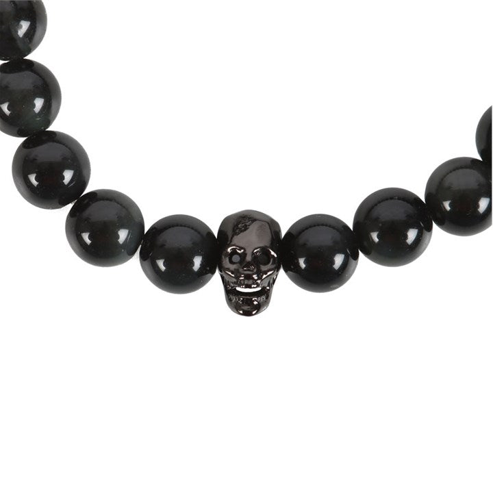 Experience the unique combination of mystique and style with this Black Obsidian Bead Bracelet, featuring an eye-catching black stainless steel skull charm. Designed with an elasticated band, this bracelet ensures a comfortable and flexible fit for any wrist.