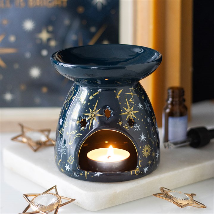 Awaken your sacred space with the celestial energy of this stunning ceramic oil burner and wax warmer. Crafted to embody the mystery of a starry night, it invites cosmic calm and spiritual balance into your home. As the gentle glow of a tealight flickers beneath, the star-patterned design casts enchanting shadows, creating an atmosphere ripe for meditation, ritual, or peaceful relaxation. Use it to melt your favorite wax melts or diffuse diluted fragrance oils, filling your sanctuary with uplifting, healing