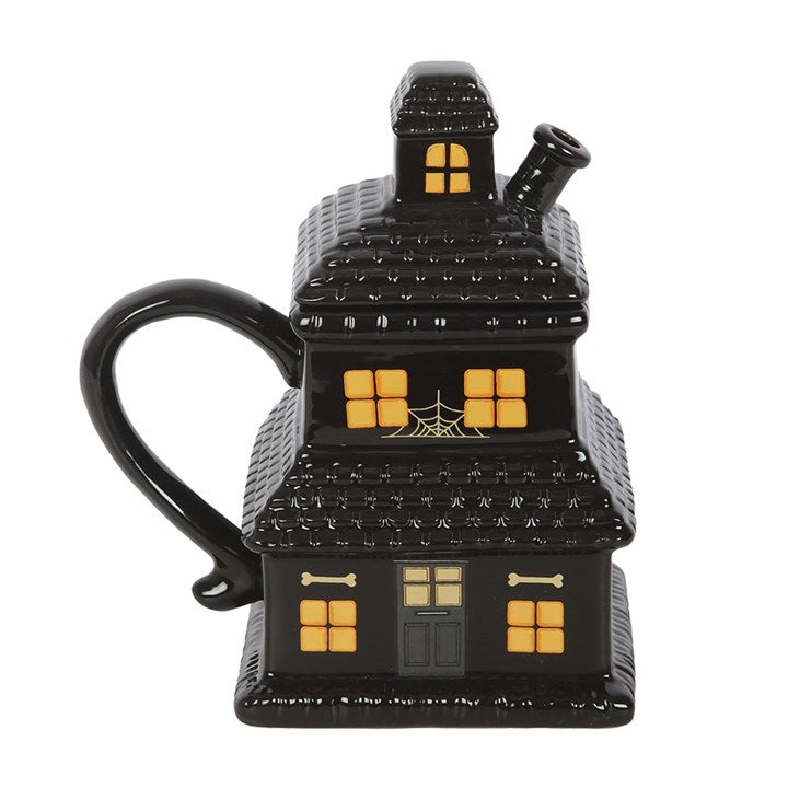 Embrace the mystic dawn with this ceramic mug shaped like a haunted house. Its detailed, shadowy design enchants any Halloween lover’s collection. Ideal for your morning brew or a warming cocoa, this 480ml vessel whispers secrets of the night. Remember, to preserve its magic, hand wash only and avoid the microwave.