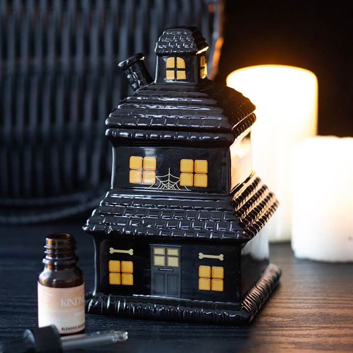Add a touch of haunted elegance to your home with this haunted house oil burner and wax warmer. Suitable for both wax melts and diluted fragrance oils, this spooky piece creates a warm glow while diffusing your favourite eerie aromas. Simply place a tealight in the holder, remove the lid while in use, and enjoy. Always allow to cool before handling.