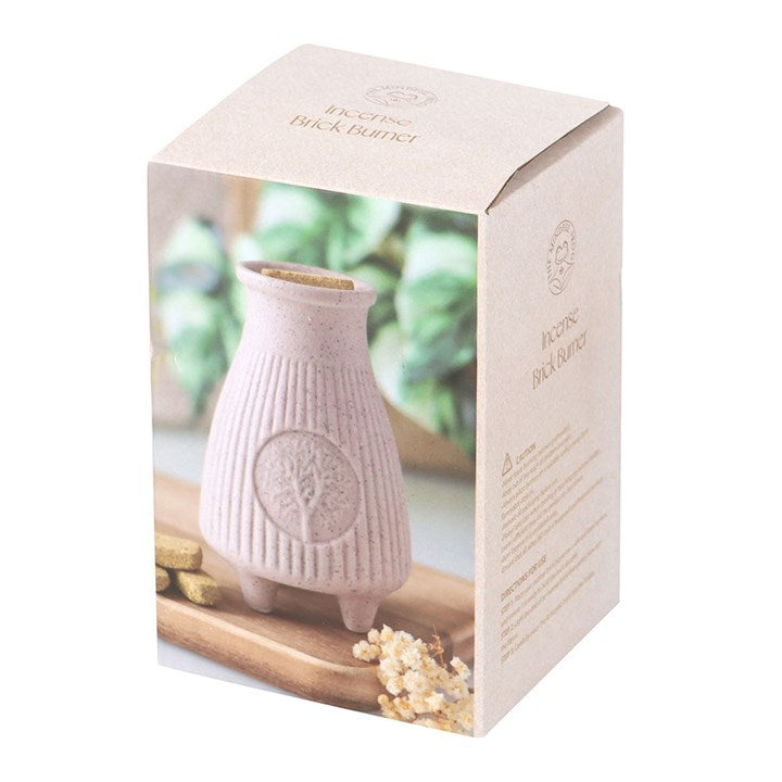 This greige ribbed ceramic Palo Santo Brick burner is perfect for safely holding and burning Palo Santo incense bricks. Its ribbed texture adds a contemporary yet timeless touch to any space. Cleansing and purifying negative energies, this burner can be used to enhance spiritual rituals or used as a decorative accent.
