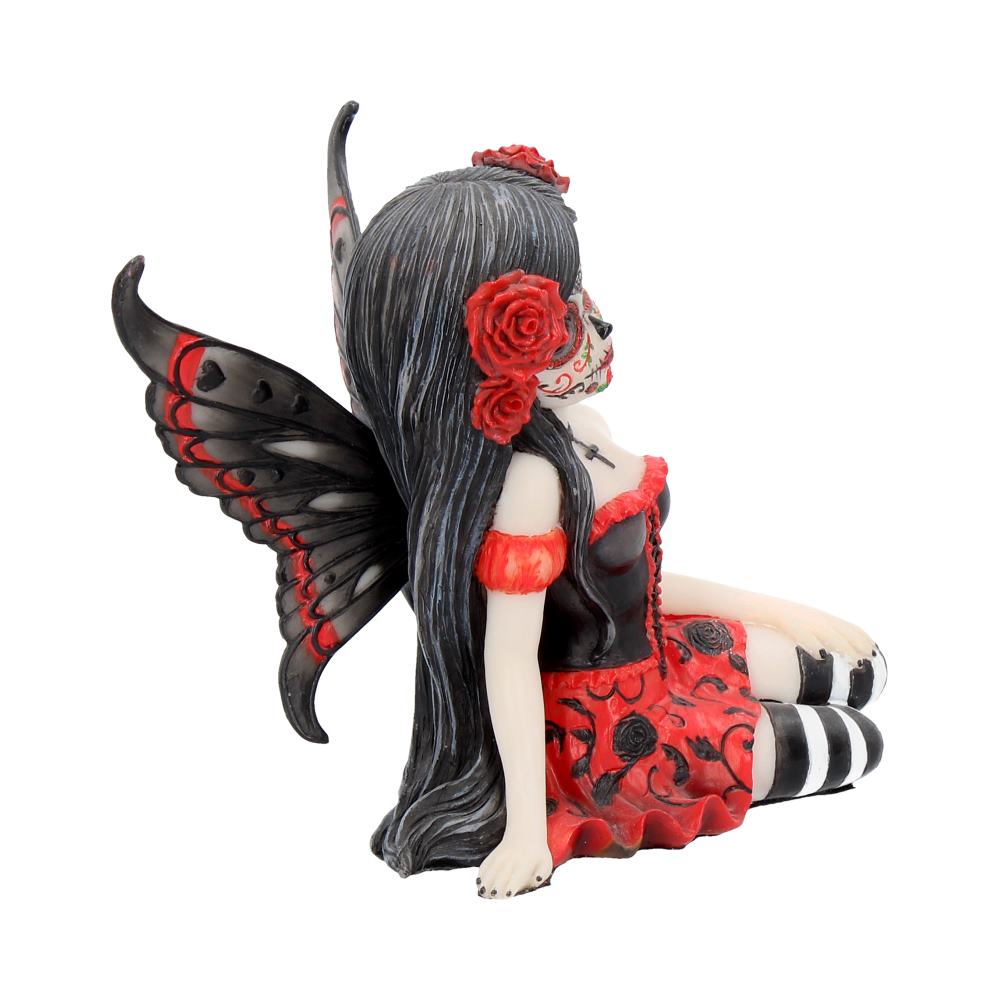 Decorative figurine of a fairy with red and black details on a white background