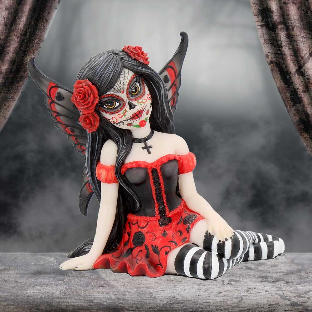 Gothic-style figurine with black hair, red flowers, and a red dress on a gray background.