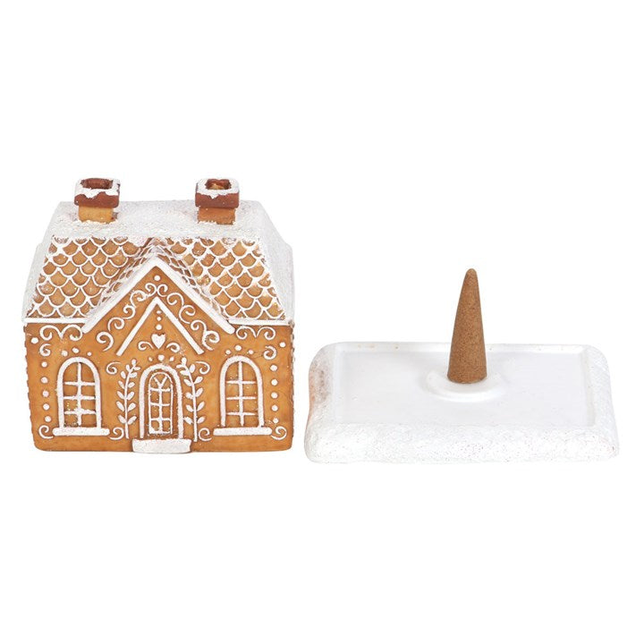 This enchanting incense cone burner takes the form of a gingerbread house dusted with shimmering snow and glitter. Light an incense cone beneath it and witness magical wisps of smoke drift from its twin chimneys. A charming and mystical addition to your Yuletide rituals.