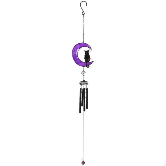 Embrace the enchanting whispers of the Black Cat Windchime, a mystical blend of hand-crafted metal, glass, and resin shaped into a captivating black cat design. Ethically sourced and imbued with protective energy, this windchime is perfect for both indoor sanctuaries and outdoor gardens. As gentle breezes stir its delicate chimes, invite harmony and subtle magic into your space. Measuring 50cm tall, it’s a striking talisman that balances beauty and spirit, making it an essential charm for any witch’s garden