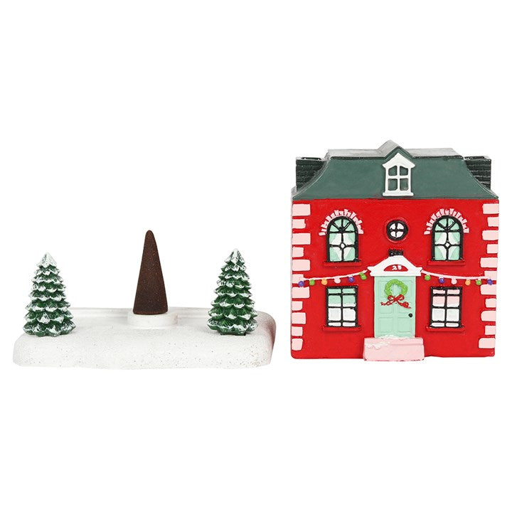 This charming Christmas house incense cone burner brings festive magic to your space. Light an incense cone inside and see mystical smoke drift from its twin chimneys, creating an enchanting holiday atmosphere. Dimensions: H8.5cm x W9.5cm x D8.5cm. Packaged size: H13cm x W13cm x D12cm.
