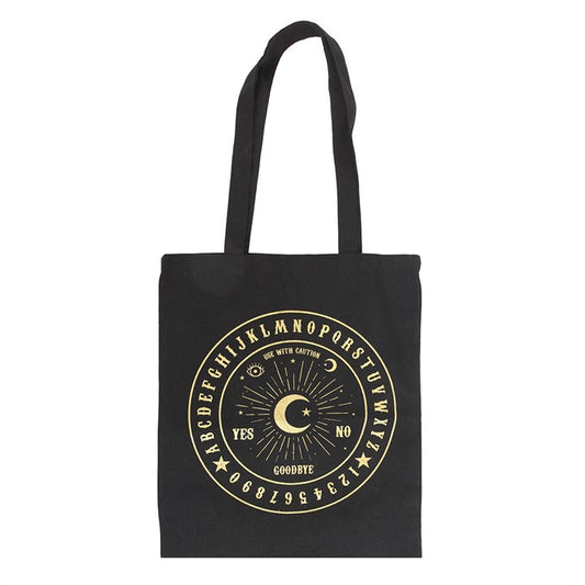 Carry your essentials with a touch of enchantment using this polycotton tote bag. Ideal for market trips, library visits, or quick adventures, it blends practicality with mystical charm. Adorned with a shimmering gold talking board motif on a deep black background, this bag channels the spirit of ancient divination. Crafted from 95% polyester and 5% cotton, it’s a bewitching, eco-conscious companion for your everyday journeys.