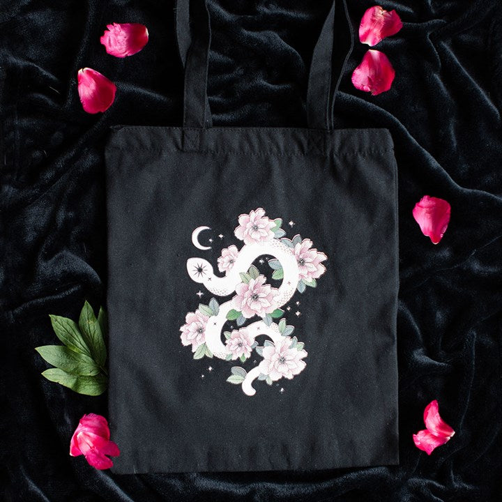 Keep your essentials in tow with this dark and elegant tote bag. Featuring a stunning floral snake graphic, it's a perfect blend of witchy and boho.
