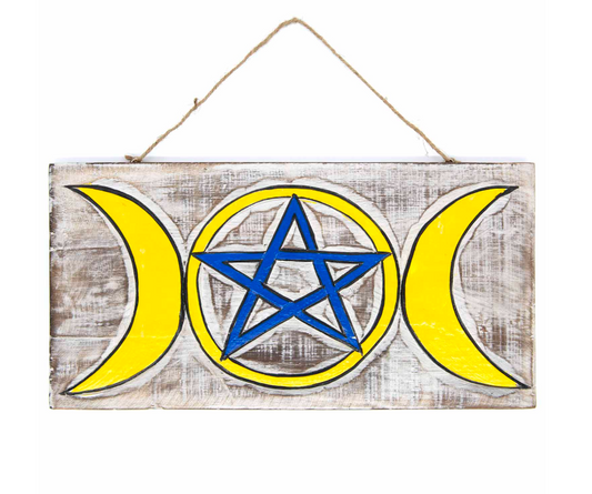 Embrace the sacred energies of the Triple Goddess with this enchanting wall plaque, featuring a striking white wash background that beautifully highlights the vibrant hand-painted design. The intertwined symbols of the Triple Goddess and pentacle invite protection, balance, and spiritual connection into your space. Crafted with care and Fairtrade certified from Indonesia, this mystical piece carries both meaning and ethical craftsmanship. Measuring approximately 39cm by 20cm, it comes ready to hang with thi