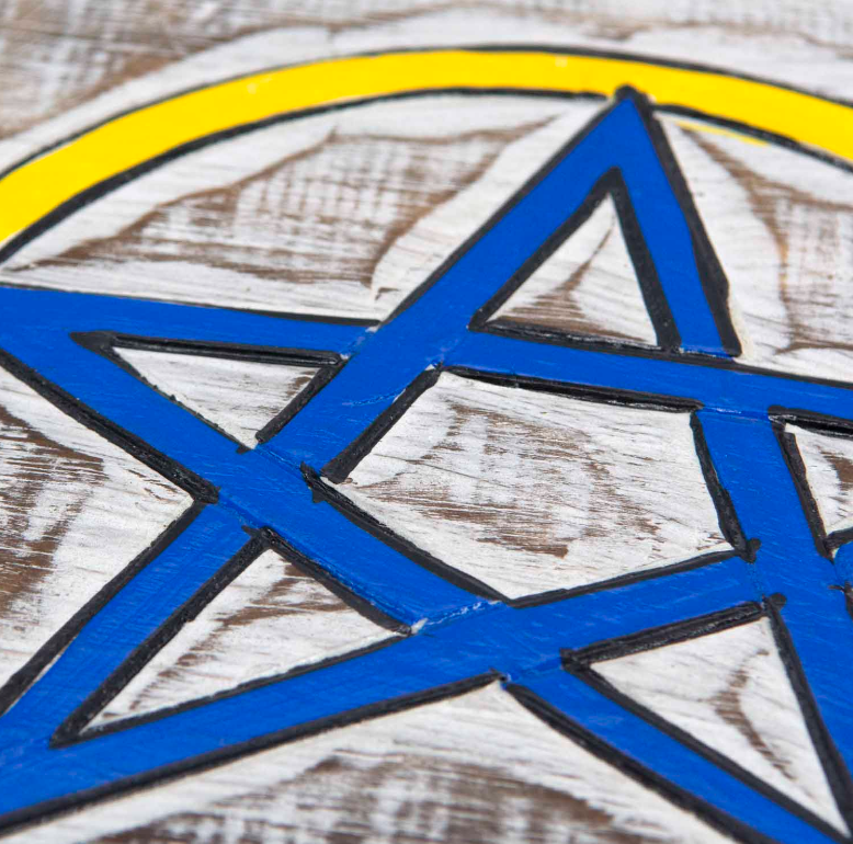Embrace the sacred energies of the Triple Goddess with this enchanting wall plaque, featuring a striking white wash background that beautifully highlights the vibrant hand-painted design. The intertwined symbols of the Triple Goddess and pentacle invite protection, balance, and spiritual connection into your space. Crafted with care and Fairtrade certified from Indonesia, this mystical piece carries both meaning and ethical craftsmanship. Measuring approximately 39cm by 20cm, it comes ready to hang with thi