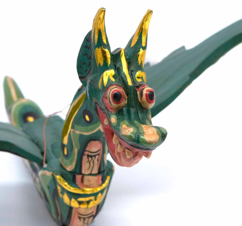Summon fierce protection and ancient wisdom with this Flying Dragon Spirit Guardian Mobile, a powerful symbol of courage, strength, and spiritual guardianship. Handcrafted in Bali and painted in vibrant colours with shimmering gold accents, this dragon is more than décor—it is a sacred protector.