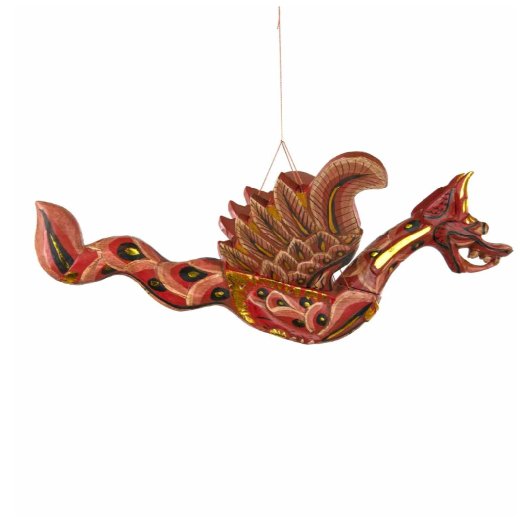 Summon fierce protection and ancient wisdom with this Flying Dragon Spirit Guardian Mobile, a powerful symbol of courage, strength, and spiritual guardianship. Handcrafted in Bali and painted in vibrant colours with shimmering gold accents, this dragon is more than décor—it is a sacred protector.
