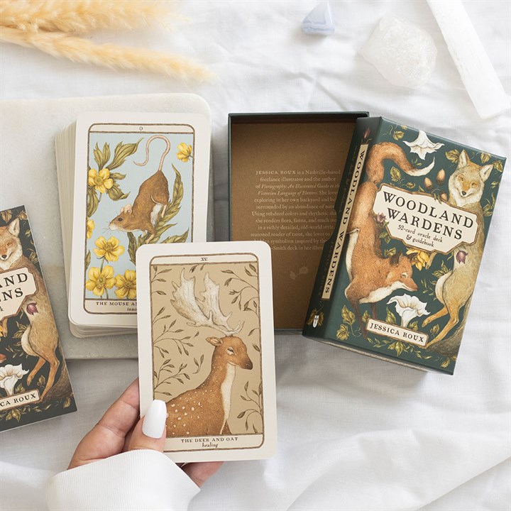 From the creator of Floriography comes an enchanting oracle deck and guidebook, richly illustrated and steeped in the magic of woodland creatures and plants. Rooted in mythology, folklore, and timeless tales, each card pairs an animal with a plant—like the hare with the oak, the finch with the peach, or the hawk with the thistle—offering profound messages. Artist Jessica Roux’s intricate, evocative artwork invites you into a mystical realm, providing wisdom, guidance, and a deep connection to the spirit of