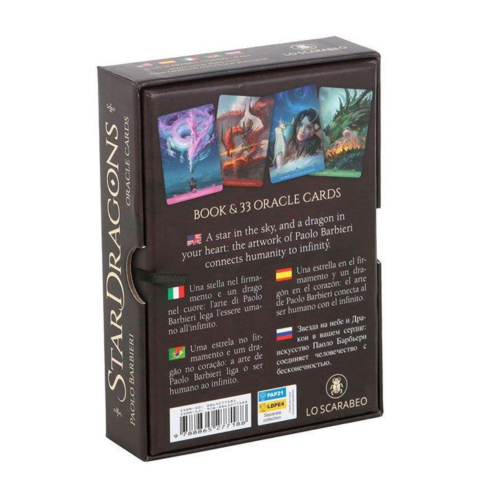 Enter the sacred skies and commune with the ancient spirits of the stars. The StarDragons Oracle by visionary artist Paolo Barbieri and mystic Rachel Paul is a portal of cosmic insight, channeling the primal force of dragons with the celestial currents of the universe.
This 33-card oracle deck, cloaked in breathtaking fantasy art, calls to the pagan soul—those who walk between realms, guided by starlight and scaled wisdom. Each card unveils a radiant dragon ally, whispering truths to seekers, dreamers, and